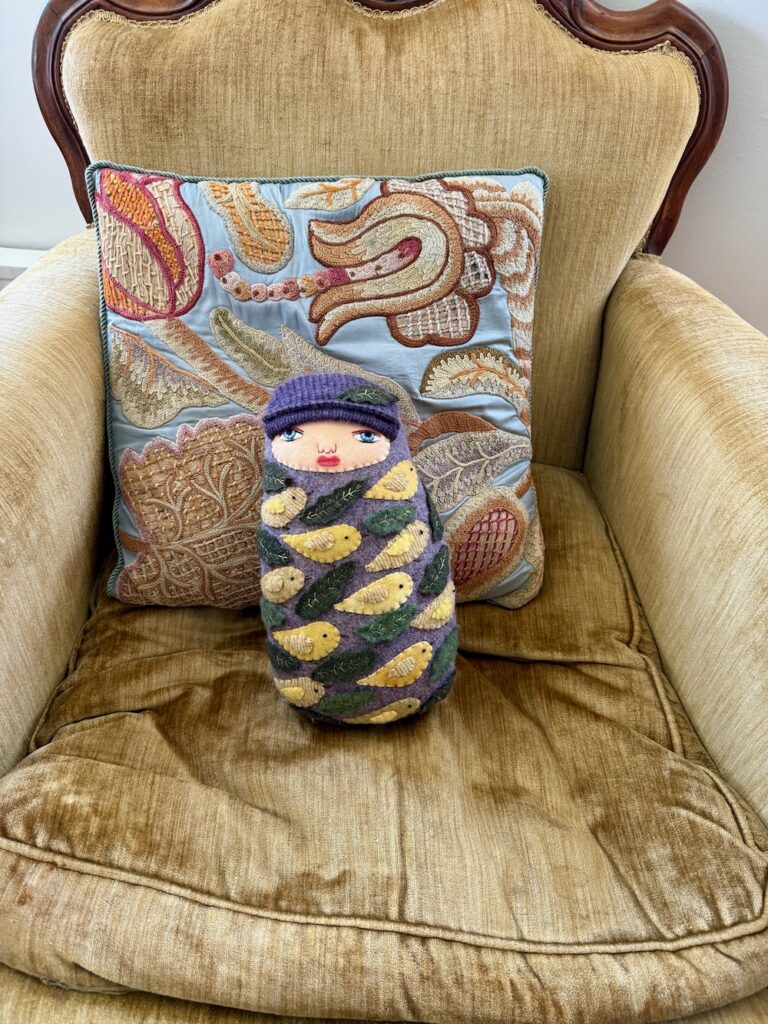swaddled baby doll